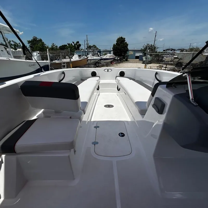 Slide: The Image of 2022 Tahoe T18 boat interior with seating and storage compartments. - 18