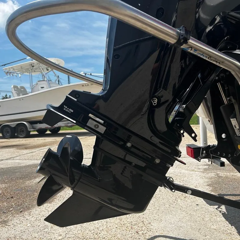 Slide: The Image of Close-up of a 2022 Tahoe T18 boat motor and propeller. - 19
