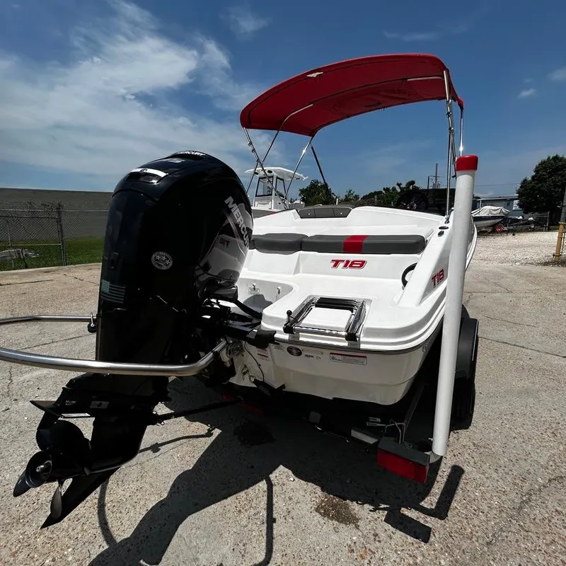 Slide: The Image of 2022 Tahoe T18 boat with outboard motor and red canopy. - 6