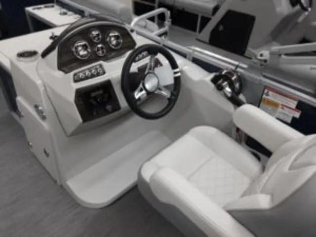 Slide: The Image of 2023 Lowe SF194 boat cockpit with steering wheel and control panel. - 7