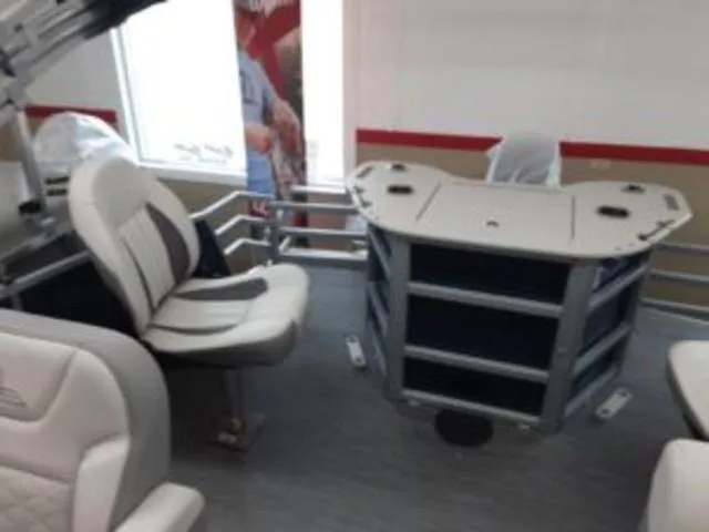 Slide: The Image of 2023 Lowe SF194 boat interior with seating and storage compartments. - 8
