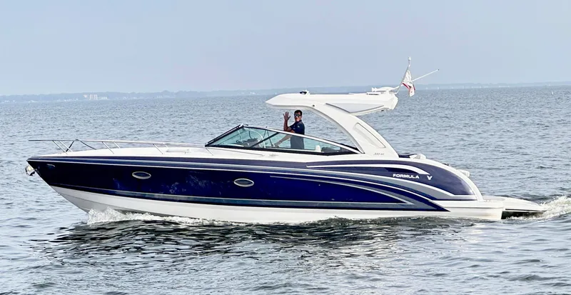 The Image of 2025 Formula 350 Sun Sport boat cruising on open water. - 0