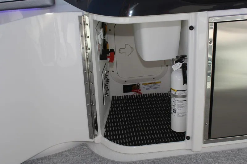 Slide: The Image of Storage compartment of 2025 Formula 350 Sun Sport boat with fire extinguisher. - 19