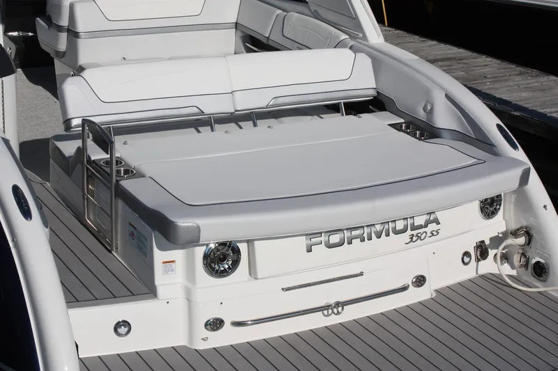 Slide: The Image of 2025 Formula 350 Sun Sport boat rear deck and seating area. - 2