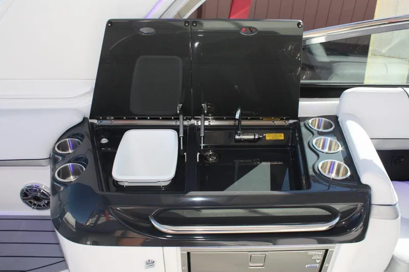 Slide: The Image of 2025 Formula 350 Sun Sport yacht cockpit with sink, storage, and cup holders. - 21