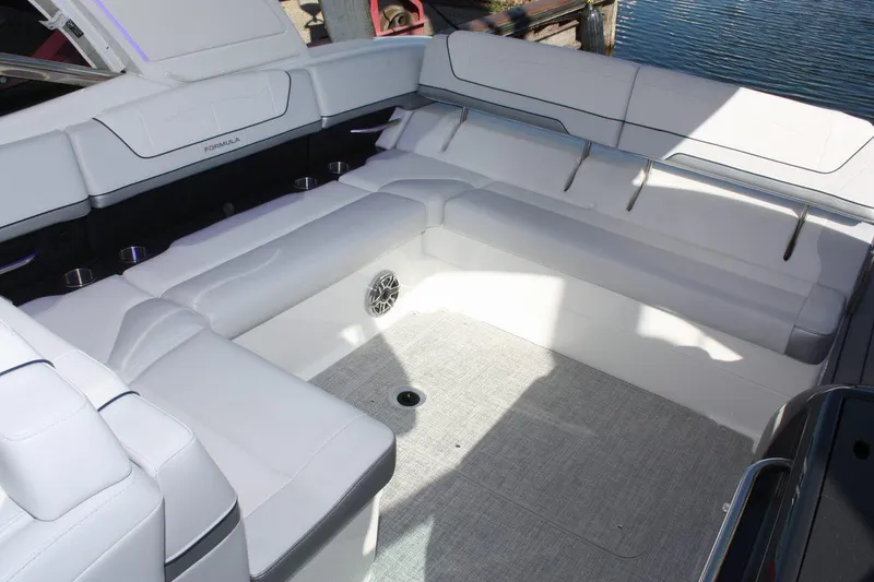Slide: The Image of 2025 Formula 350 Sun Sport boat interior with white cushioned seating. - 23