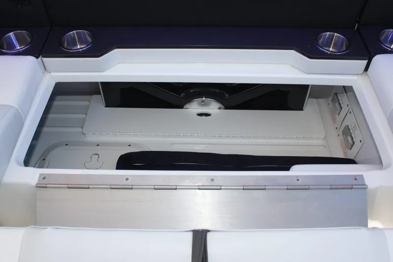Slide: The Image of 2025 Formula 350 Sun Sport storage compartment with cup holders. - 24