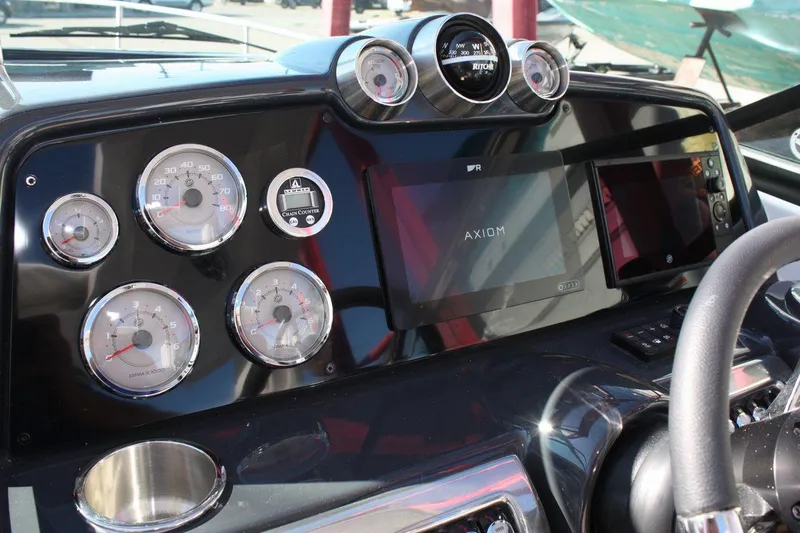 Slide: The Image of Dashboard of a 2025 Formula 350 Sun Sport boat with gauges and Axiom display. - 29