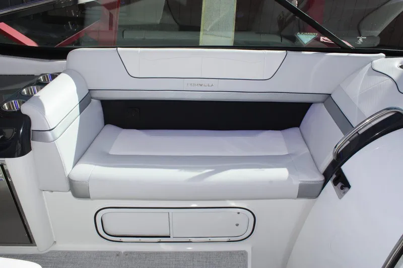 Slide: The Image of 2025 Formula 350 Sun Sport boat interior seating area with white upholstery. - 36