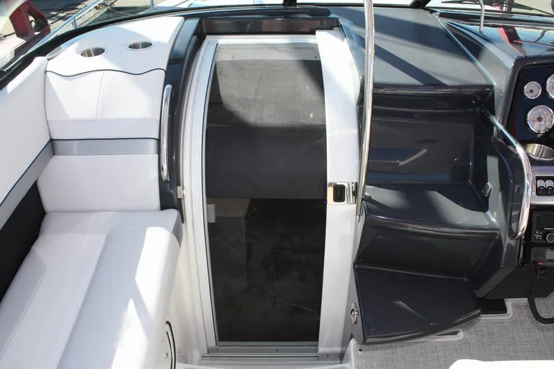 Slide: The Image of 2025 Formula 350 Sun Sport boat interior with seating and cabin entrance. - 37