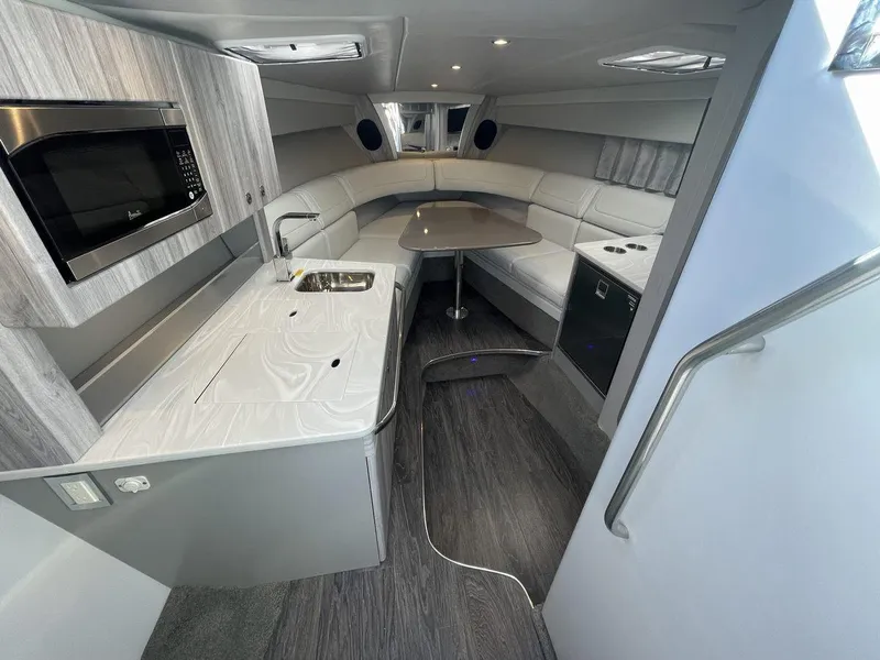 Slide: The Image of 2025 Formula 350 Sun Sport interior with modern kitchen and seating area. - 38