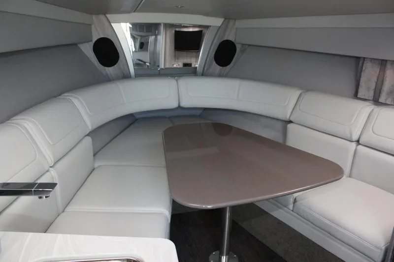 Slide: The Image of Luxurious interior of the 2025 Formula 350 Sun Sport with curved seating and a sleek table. - 39