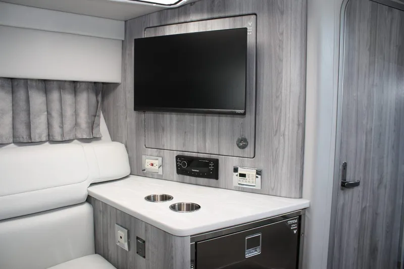Slide: The Image of 2025 Formula 350 Sun Sport interior with TV, modern cabinetry, and seating. - 40