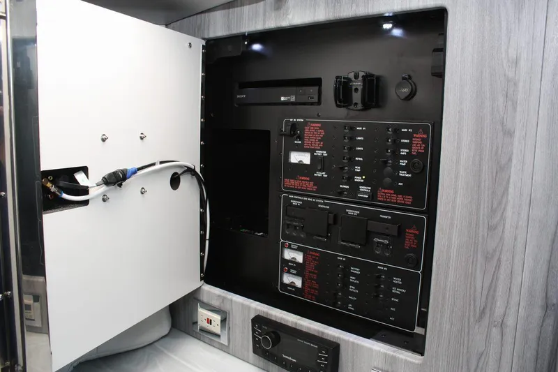 Slide: The Image of 2025 Formula 350 Sun Sport electrical control panel with open access door. - 41