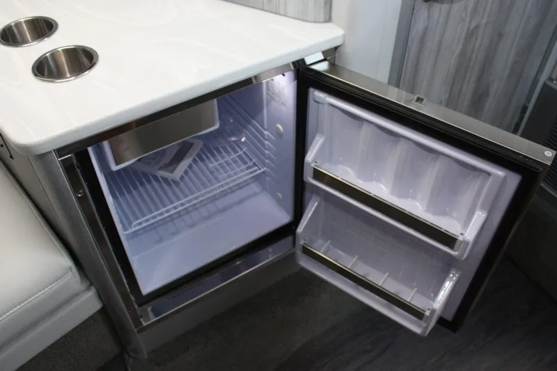 Slide: The Image of Open mini fridge in 2025 Formula 350 Sun Sport boat interior. - 43
