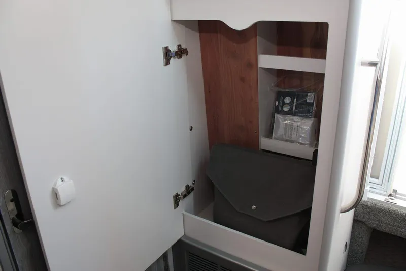 Slide: The Image of 2025 Formula 350 Sun Sport interior storage cabinet with shelves and accessories. - 45