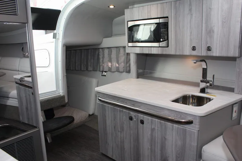Slide: The Image of Modern interior of 2025 Formula 350 Sun Sport boat with kitchenette and seating area. - 46
