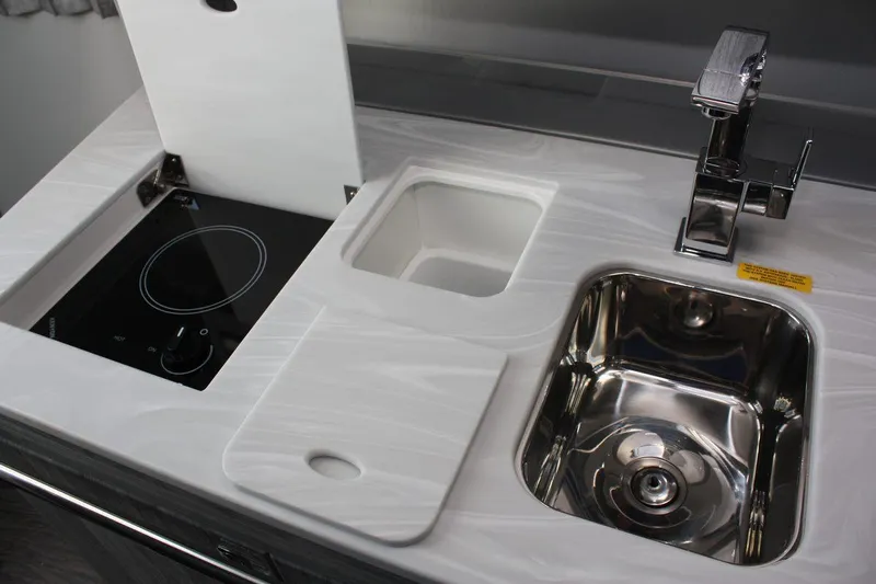 Slide: The Image of Modern kitchen area in 2025 Formula 350 Sun Sport boat with sink and stove. - 47