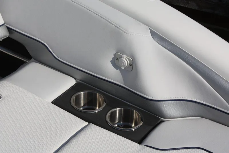 Slide: The Image of 2025 Formula 350 Sun Sport boat interior with cup holders and white upholstery. - 7