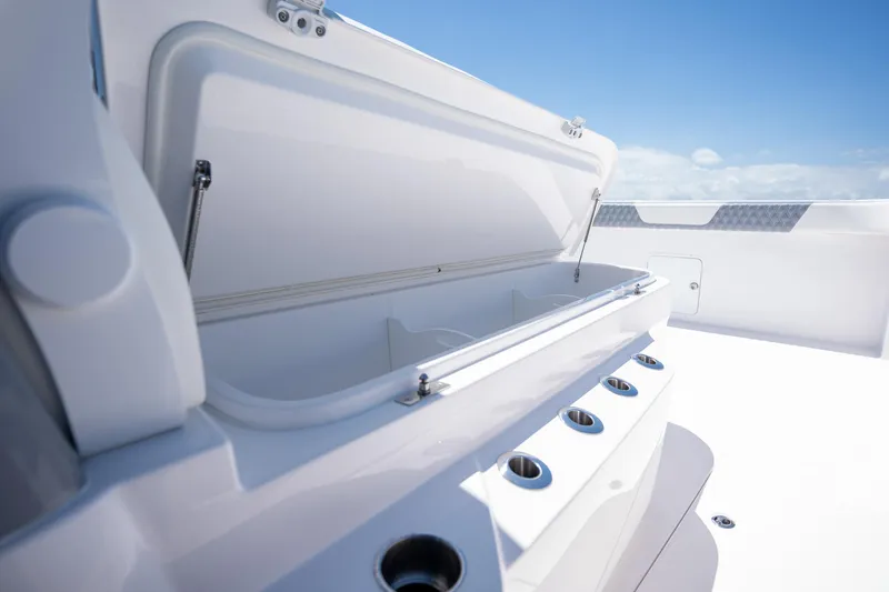 Slide: The Image of 2024 Invincible 46 Catamaran open storage compartment on deck, showcasing sleek design and functionality. - 10