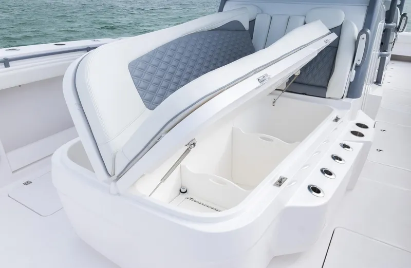 Slide: The Image of 2024 Invincible 46 Catamaran with open storage compartment on deck. - 11