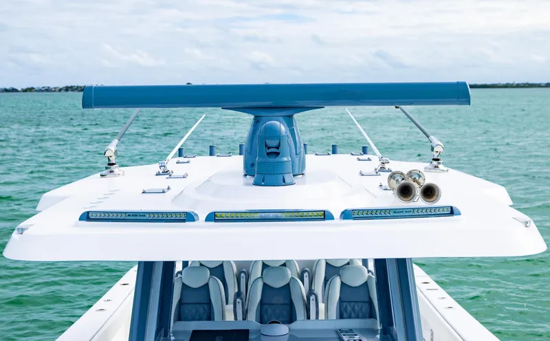 Slide: The Image of 2024 Invincible 46 Catamaran on water, showcasing sleek design and advanced features. - 13