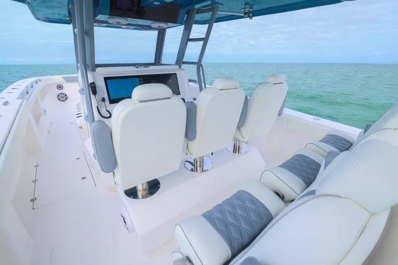Slide: The Image of 2024 Invincible 46 Catamaran interior with luxurious seating and ocean view. - 15