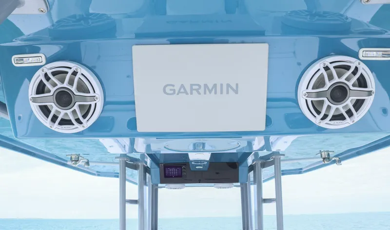 Slide: The Image of 2024 Invincible 46 Catamaran with Garmin electronics and speakers on a blue panel. - 19