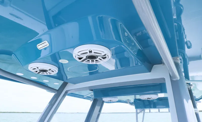Slide: The Image of 2024 Invincible 46 Catamaran interior with blue ceiling and built-in speakers. - 20