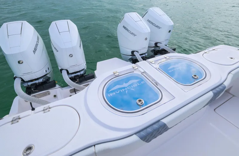 Slide: The Image of 2024 Invincible 46 Catamaran with four Mercury engines on water. - 24
