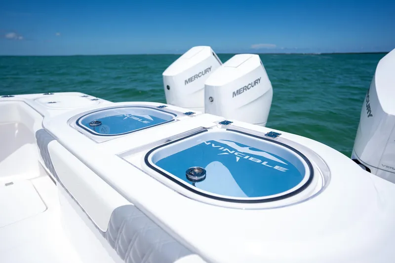 Slide: The Image of 2024 Invincible 46 Catamaran with Mercury engines on open water. - 25