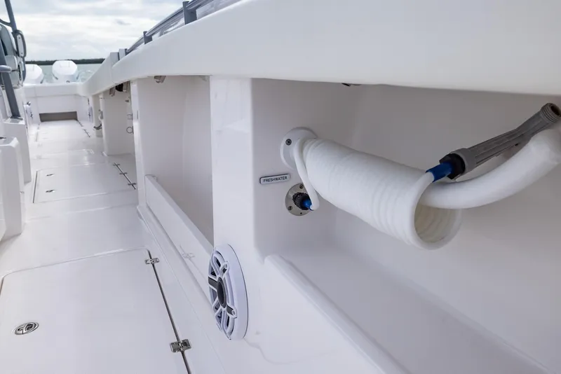 Slide: The Image of 2024 Invincible 46 Catamaran deck with storage compartments and marine equipment. - 29