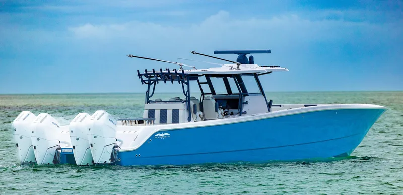 Slide: The Image of 2024 Invincible 46 Catamaran in blue on calm sea. - 3