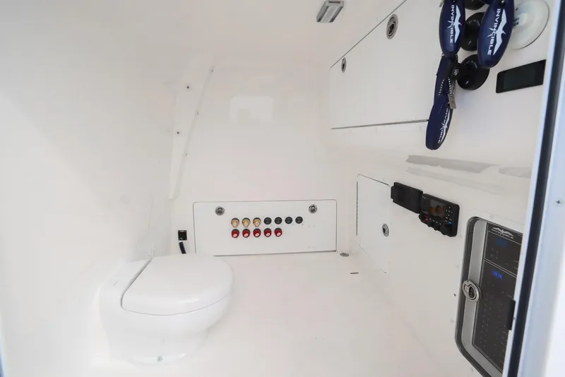 Slide: The Image of 2024 Invincible 46 Catamaran interior with toilet and control panel. - 32