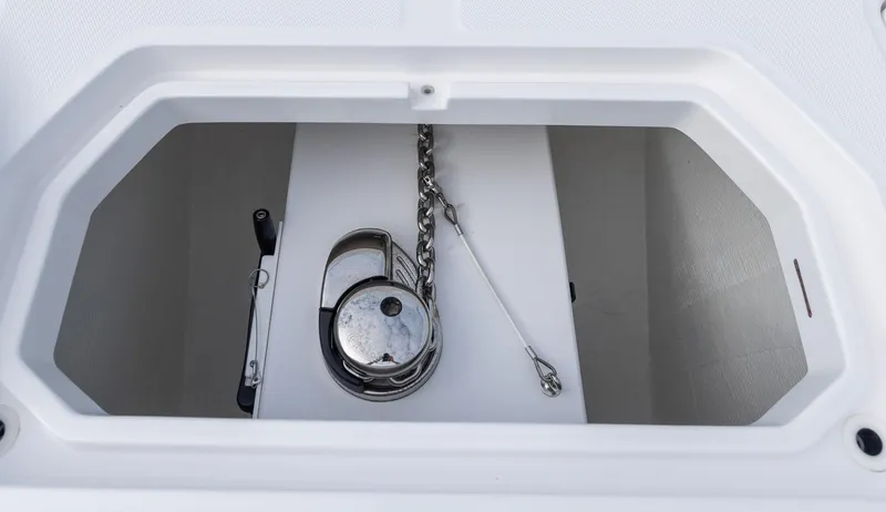 Slide: The Image of Anchor compartment of 2024 Invincible 46 Catamaran with chain and winch. - 6