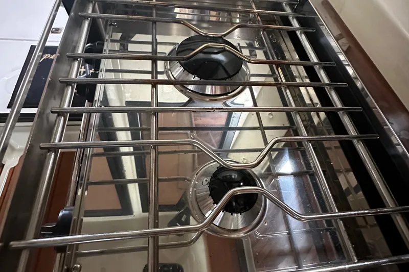 Slide: The Image of Stainless steel two-burner stove in 2021 Ranger Tugs R-27 boat kitchen. - 10