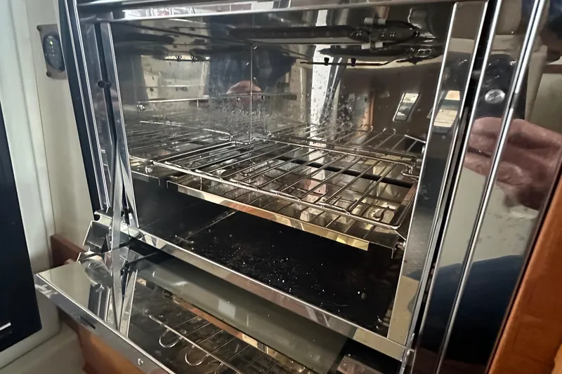 Slide: The Image of Stainless steel oven inside a 2021 Ranger Tugs R-27 boat. - 9