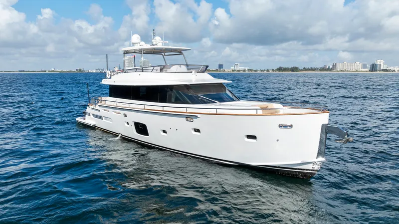 Slide: The Image of Luxury 2016 Azimut Magellano 76 yacht cruising on open water under a cloudy sky. - 3