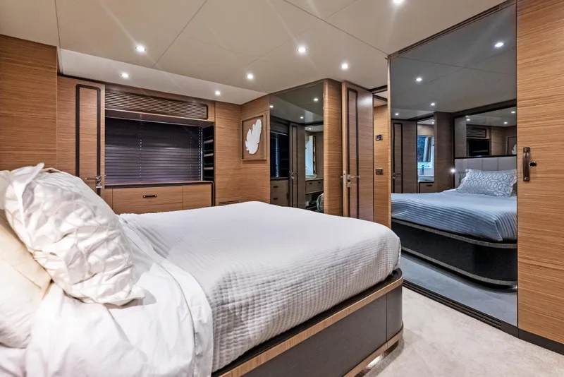 Slide: The Image of Luxurious bedroom interior of 2016 Azimut Magellano 76 yacht with modern wood finishes. - 30