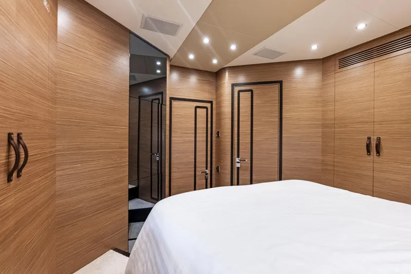 Slide: The Image of Luxurious interior of 2016 Azimut Magellano 76 yacht with wood paneling and modern design. - 35