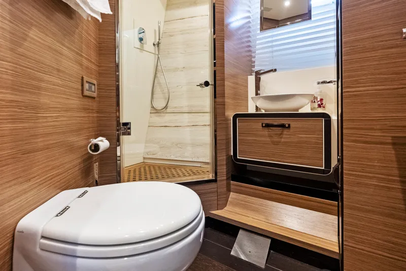 Slide: The Image of Luxurious bathroom interior on 2016 Azimut Magellano 76 yacht, featuring modern fixtures and wood accents. - 36