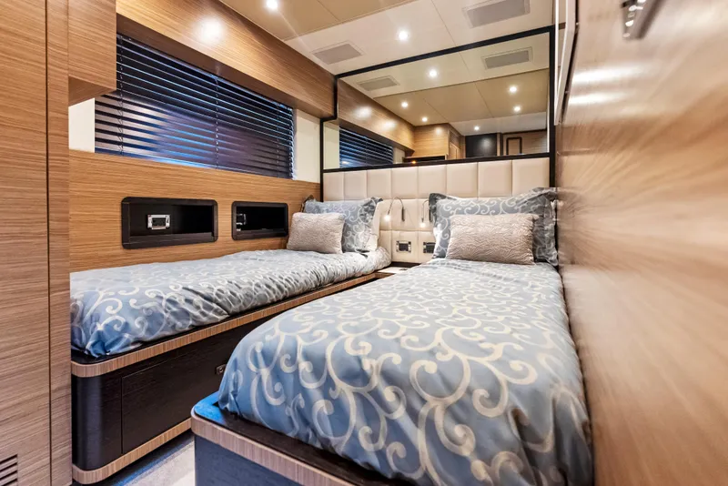 Slide: The Image of Luxurious twin bedroom in 2016 Azimut Magellano 76 yacht with elegant bedding and modern design. - 37