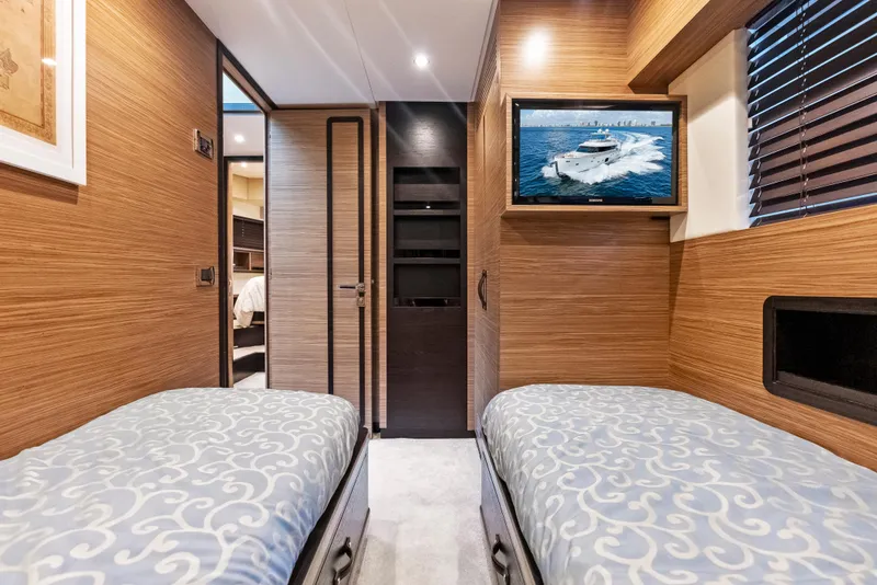 Slide: The Image of Interior of 2016 Azimut Magellano 76 yacht with twin beds and wall-mounted TV. - 38