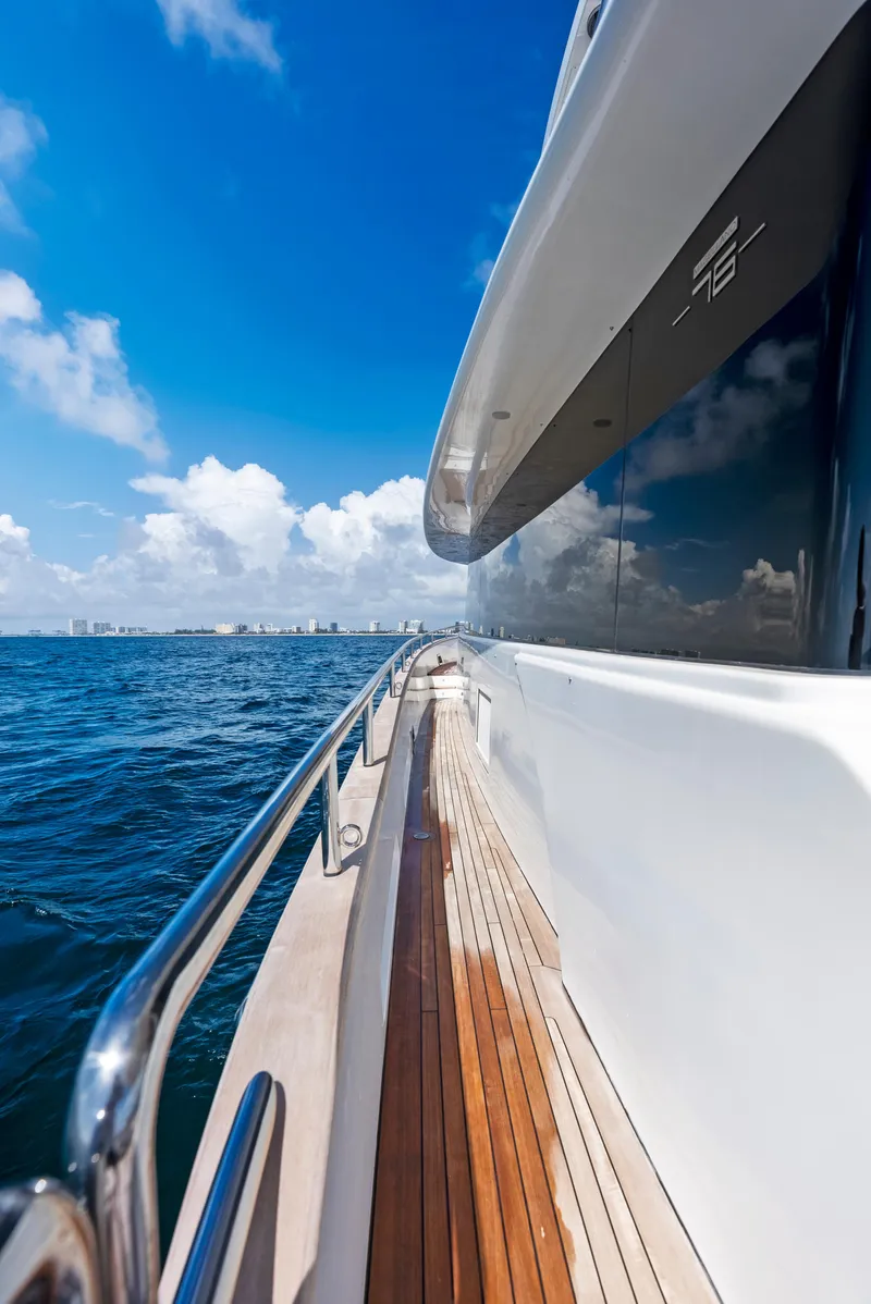 Slide: The Image of Side view of 2016 Azimut Magellano 76 yacht on open sea under clear blue sky. - 44