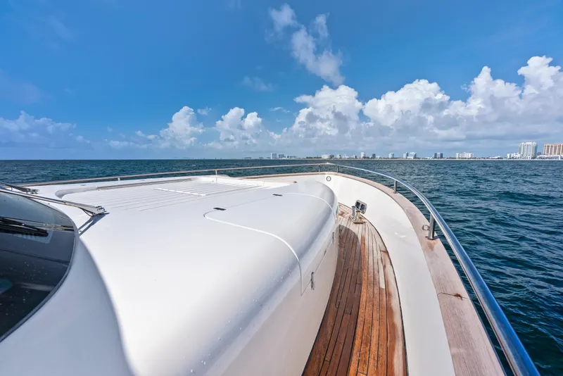 Slide: The Image of Azimut Magellano 76 yacht cruising on open sea under clear blue sky. - 45