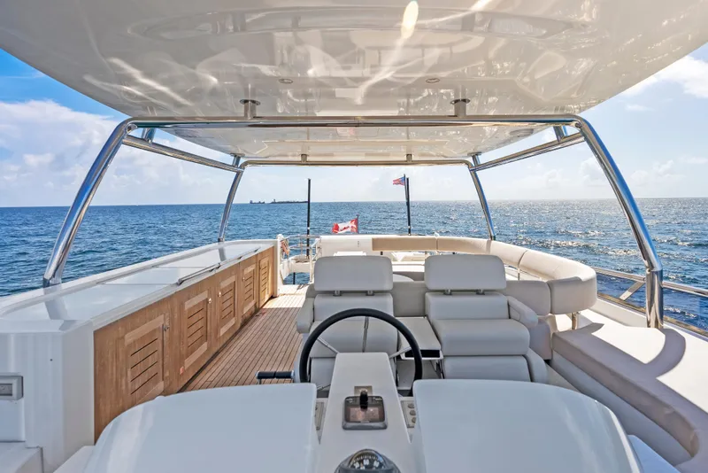 Slide: The Image of Luxurious 2016 Azimut Magellano 76 yacht interior with ocean view and elegant seating. - 49