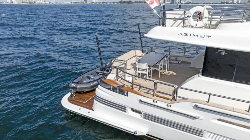 Slide: The Image of Luxury Azimut Magellano 76 yacht, 2016 model, docked on serene blue waters. - 8