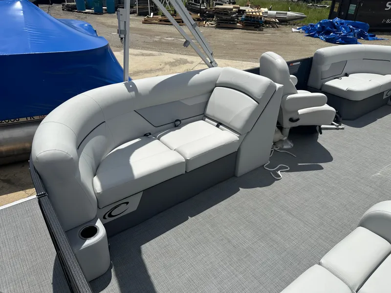 Slide: The Image of 2022 Crest Classic DLX 200 SLC pontoon boat with gray seating and deck. - 10
