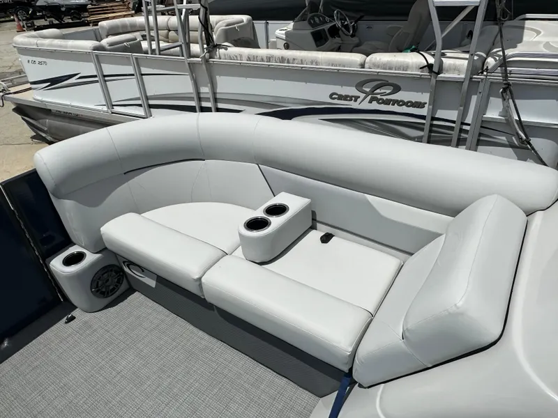 Slide: The Image of 2022 Crest Classic DLX 200 SLC pontoon boat with comfortable seating and cup holders. - 14