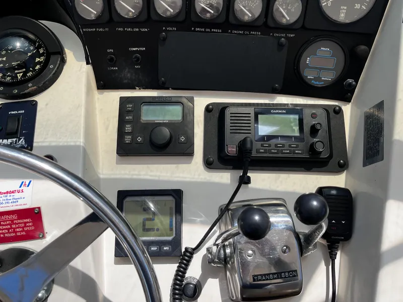 Slide: The Image of Control panel of a 1991 Hatteras 52 Cockpit Motoryacht with navigation instruments. - 13